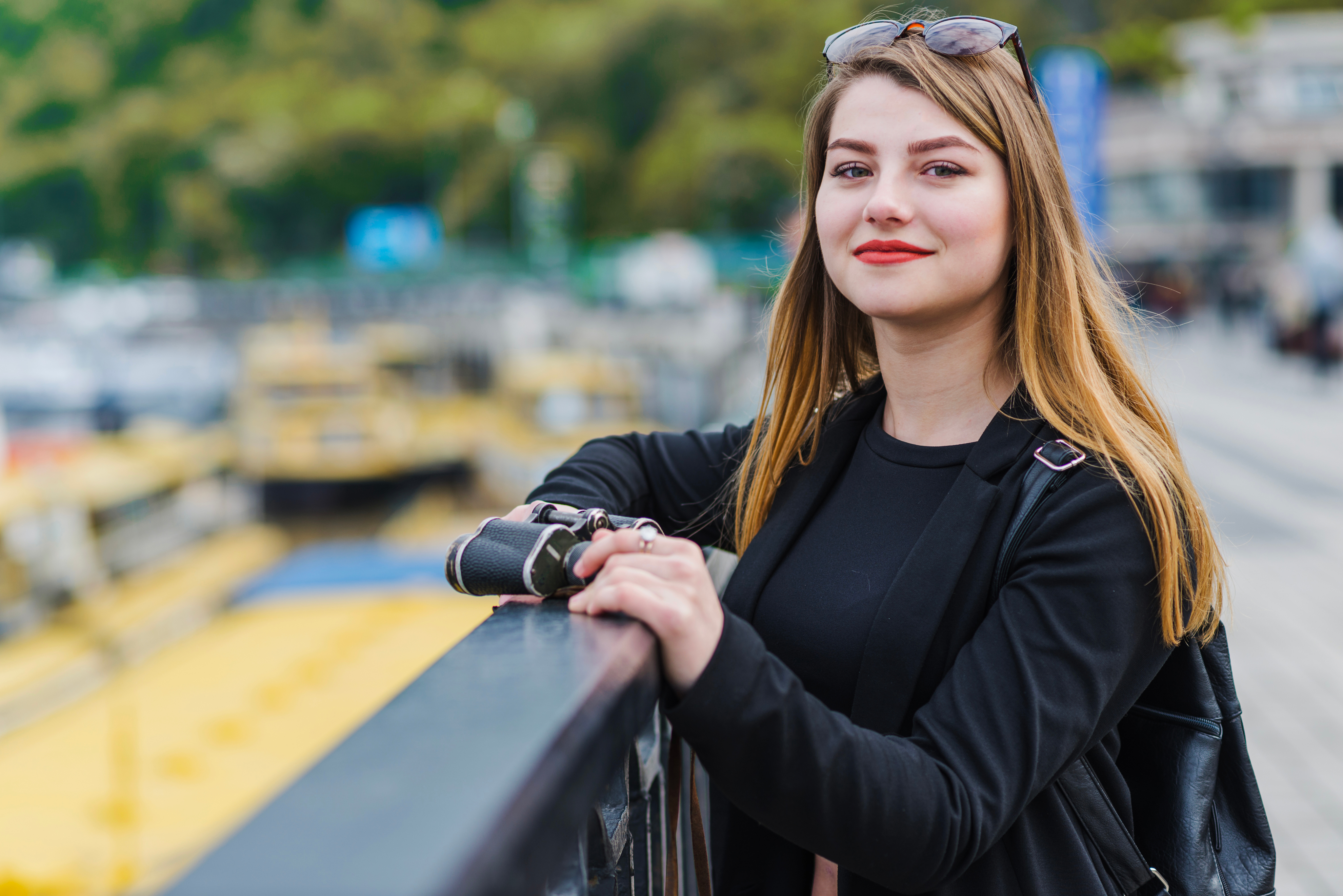 Emily smiling by a railing